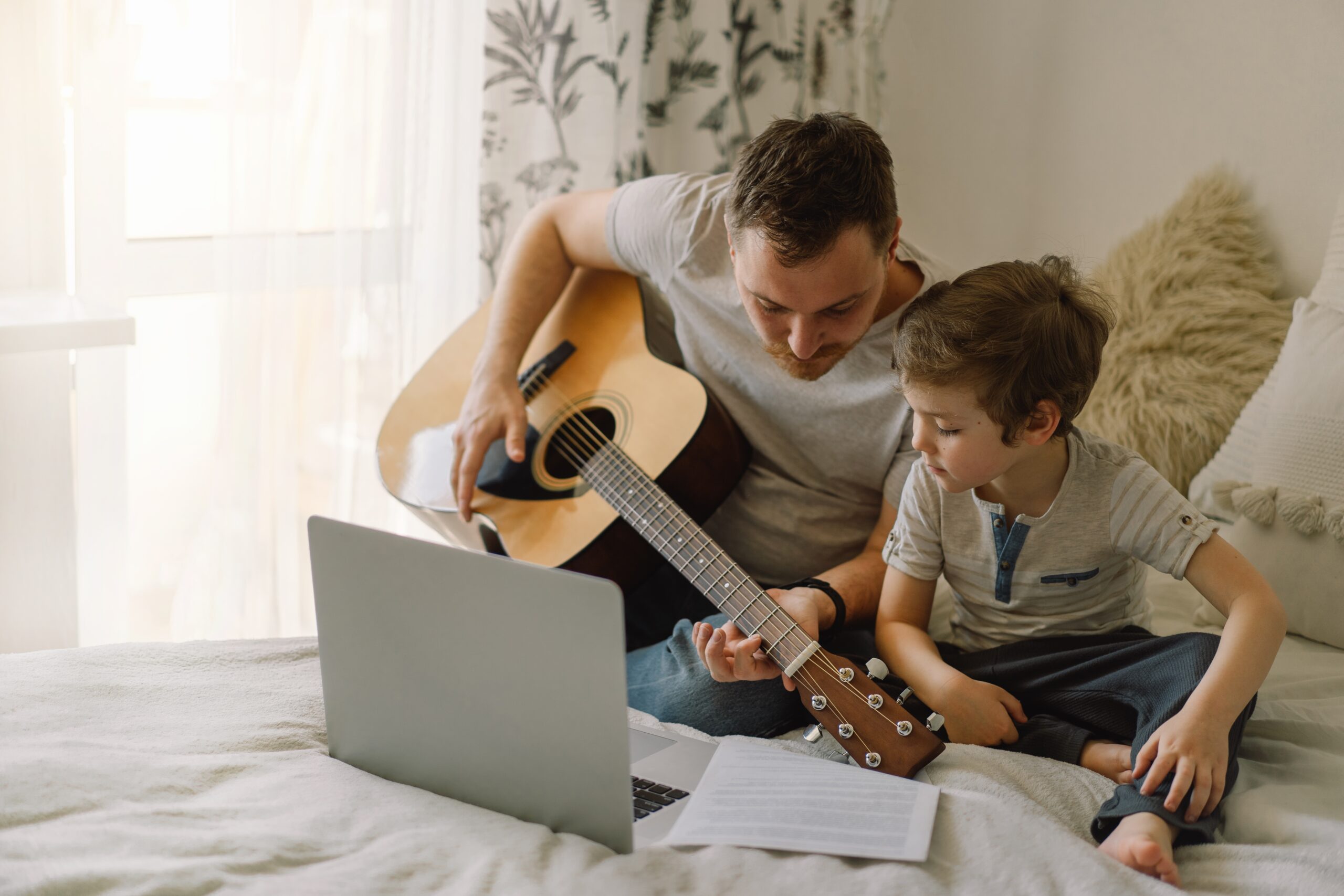 father-and-son-learn-to-play-the-acoustic-guitar-i-2021-09-02-13-02-07-utc