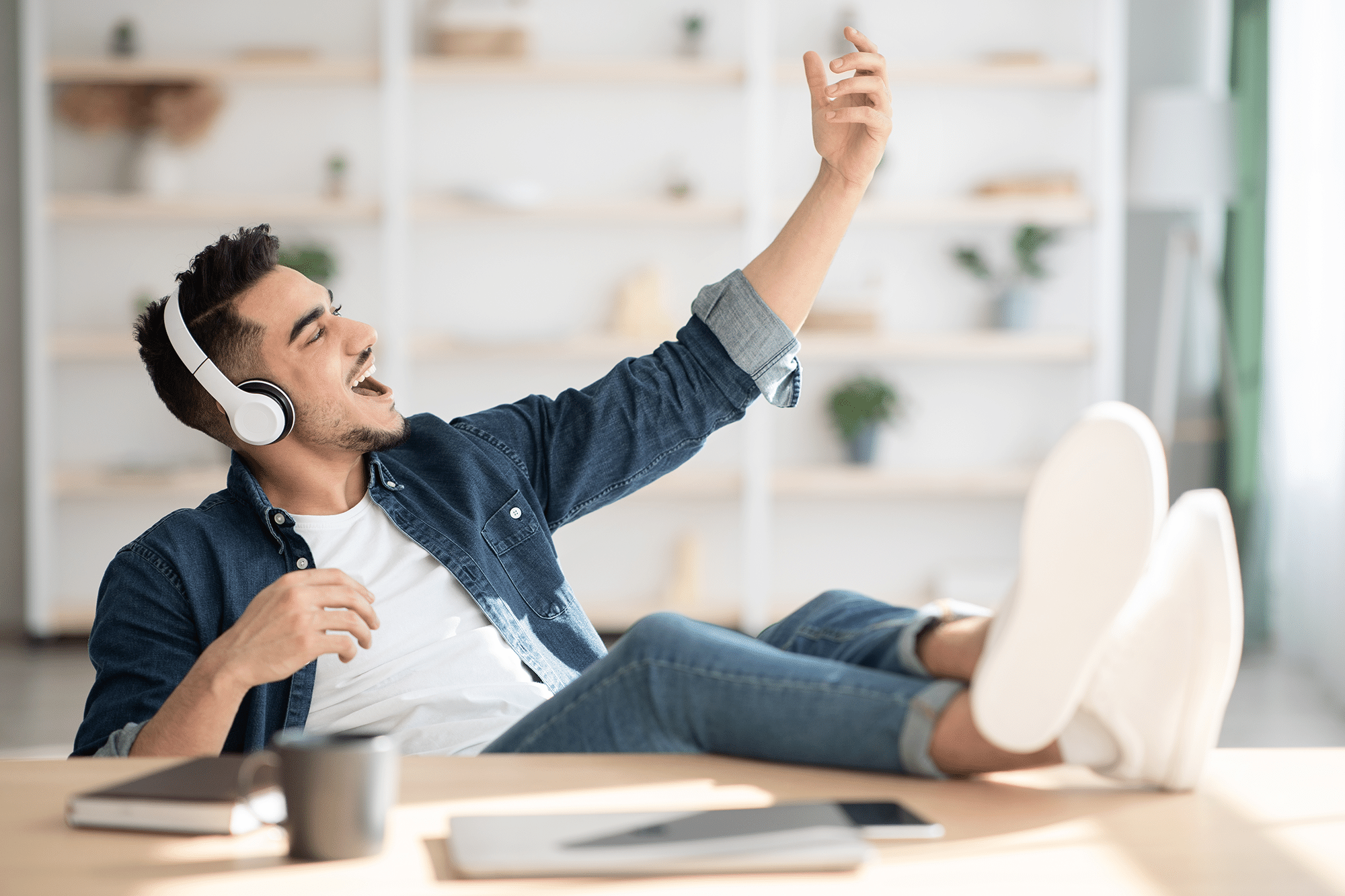 joyful-arab-guy-listening-to-music-and-playing-gui-2021-09-02-07-22-38-utc